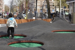 Recessed trampolines embedded in rubber surface