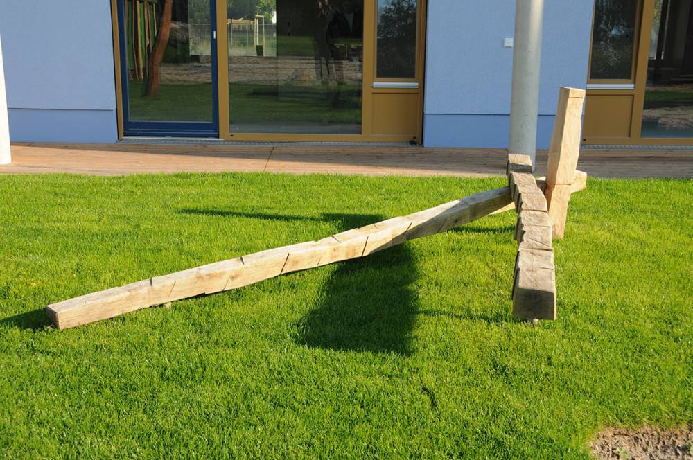 Three simple balance beams in the grass for young children