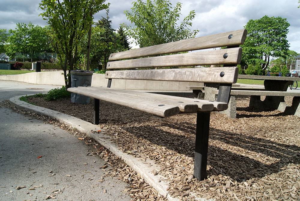 Wood bench near entrance to school