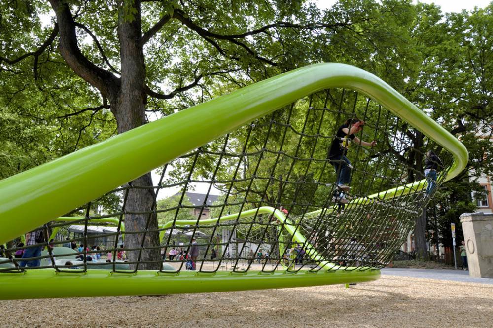 A rope net stretched between two metal pipes makes for a fun play structure