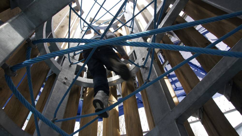 Ropes provide a way to navigate the interior of this play tower