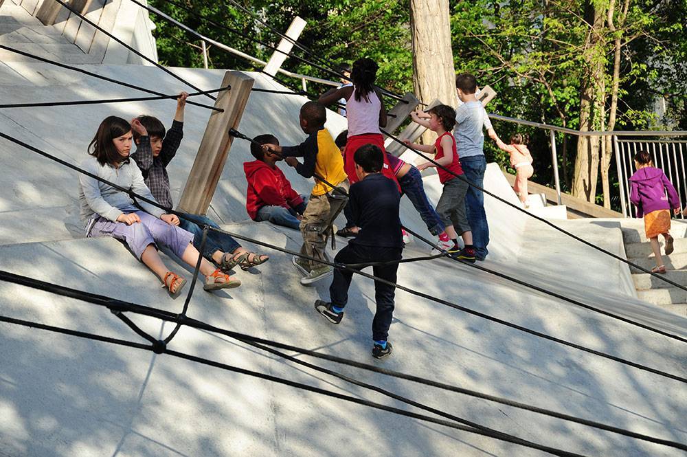 A network of ropes provides a way to scramble up a steep concrete slope