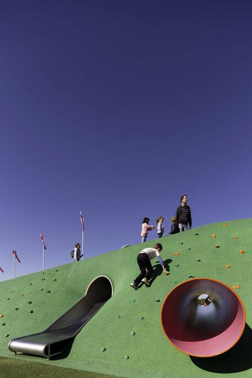 Climbing holds make it possible to scramble up a steep poured rubber slope