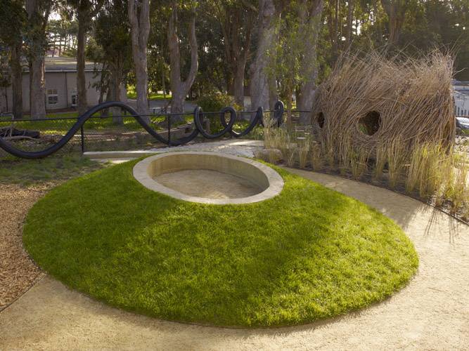 A grass mound with an embedded concrete top