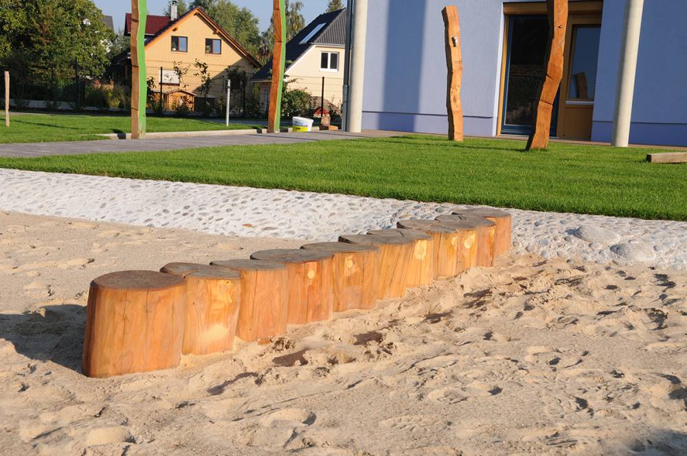 Log steppers double as a play and seating element