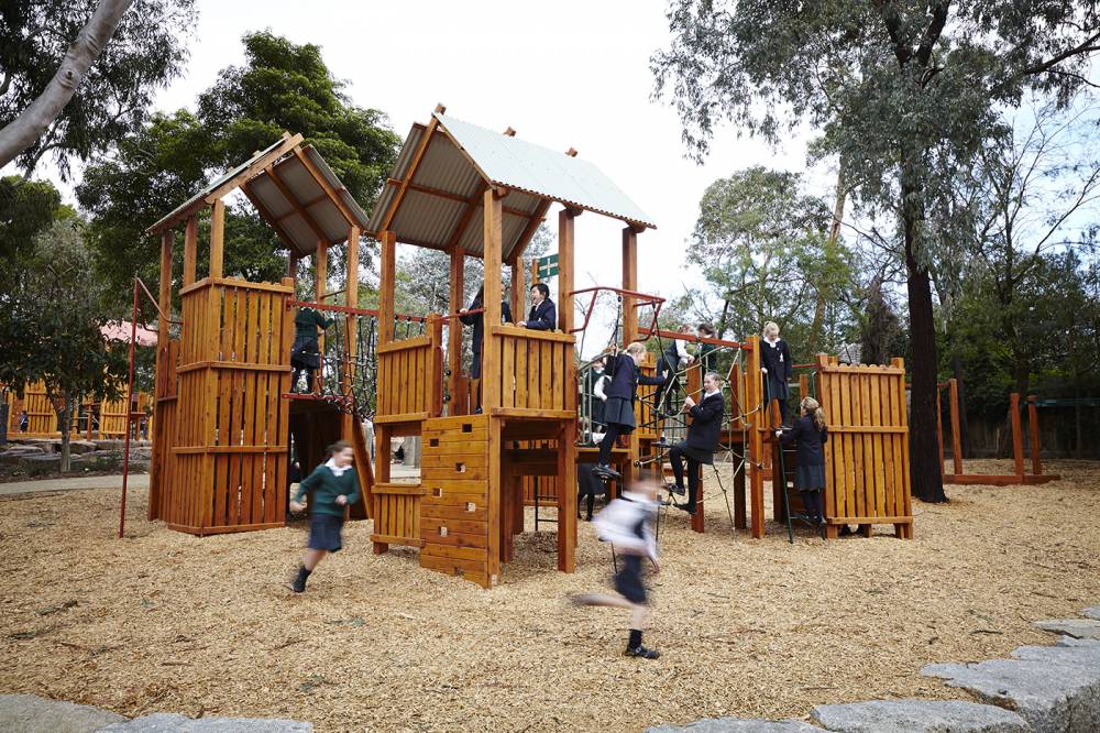 A series of play towers with soft mulch surfacing