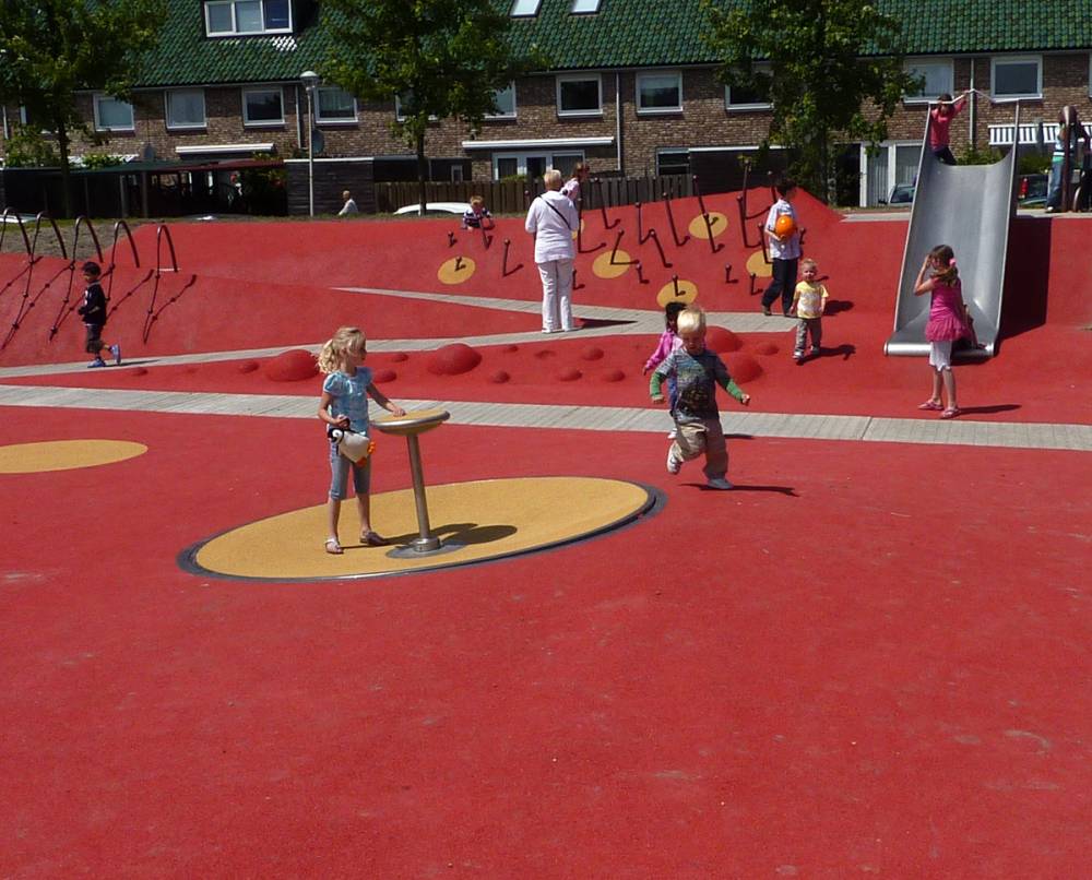Children play on the poured rubber surface
