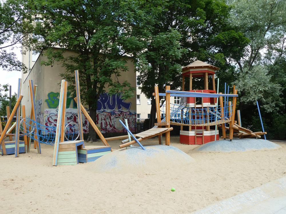 Play equipment mounted on rubber mounds