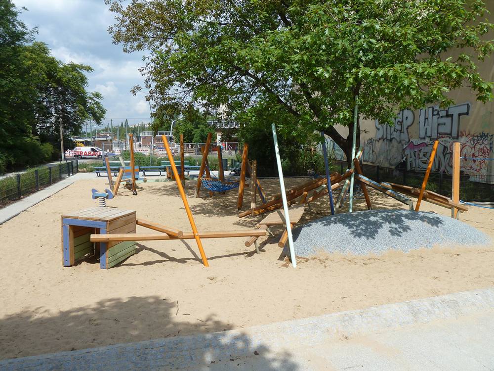 A large tree shades the play area