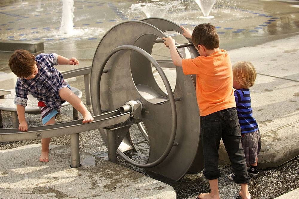 Turning the water wheel that feeds into the sluice
