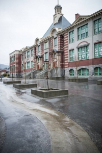 Concrete forms both raised planters and a swale that channels water through asphalt at Ridgeway Elementary, North Vancouver