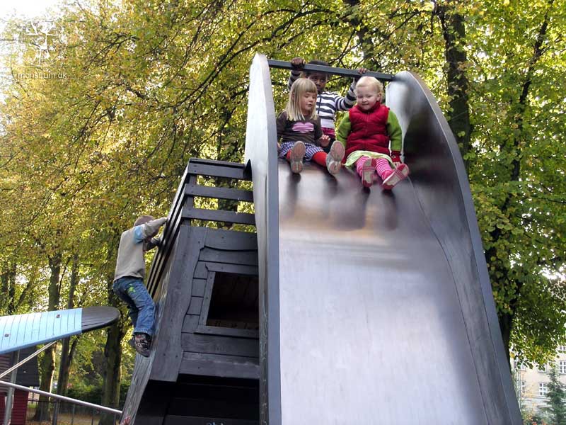 Two children on the wide slide