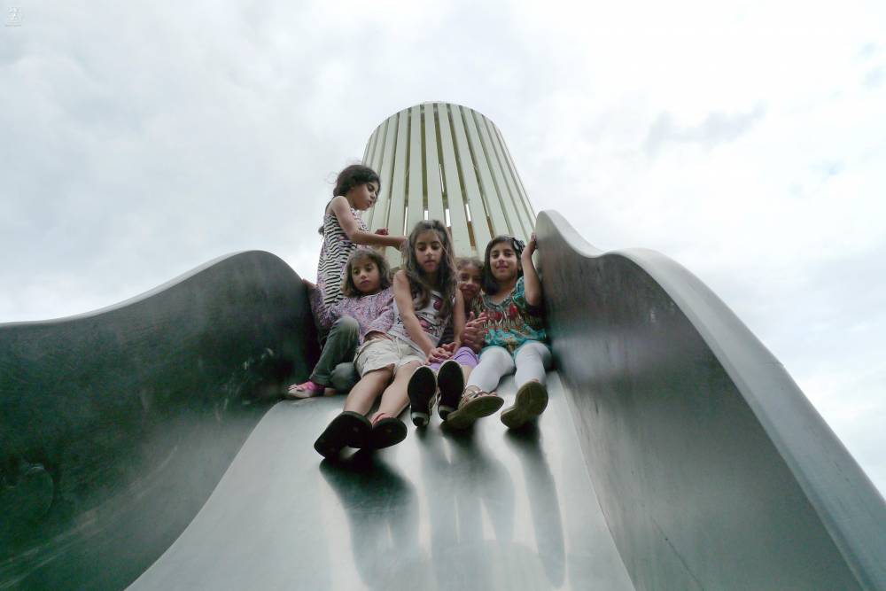 Kids playing on the wide slide