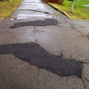 Patched holes in asphalt