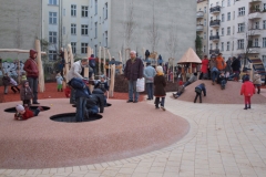 Trampolines embedded in poured rubber mound