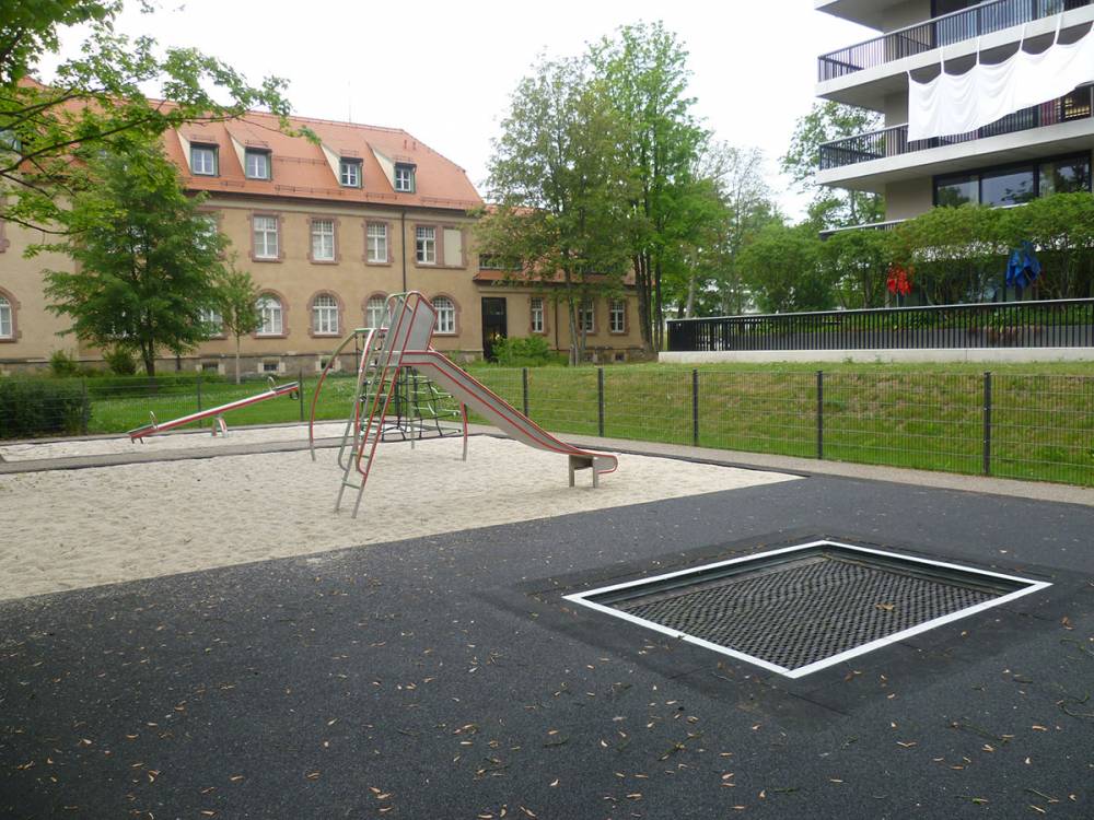 Recessed trampoline with other play structures