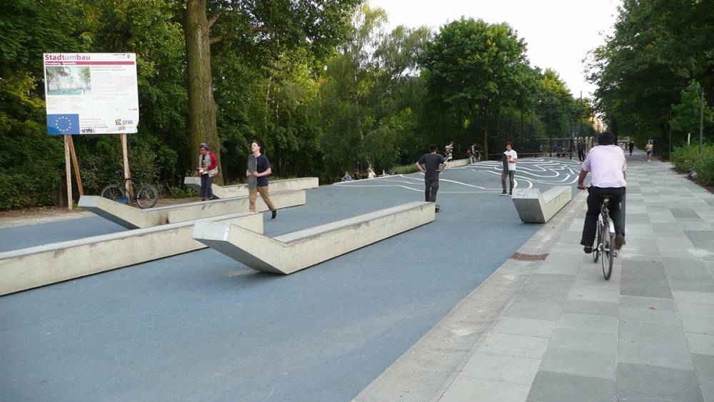 Skateboarders and cyclists sharing the square