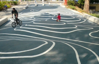 Big and small kids enjoying the island square