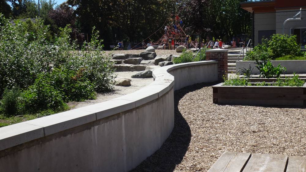 Curved wall borders the play area