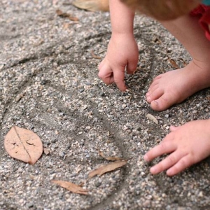 Fine packed gravel can move enough for fingerpainting