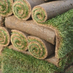 Stacked rolls of sod ready to be installed