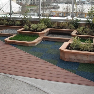 Composite decking beside tiered planters